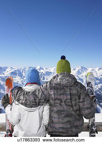 Couple admiring mountain view View Large Photo Image Stock Image - Couple admiring mountain view. Fotosearch