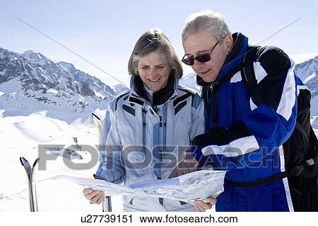 Couple reading piste map View Large Photo Image Stock Image - Couple reading piste map. Fotosearch