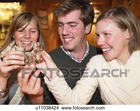 Group having shots in restaurant View Large Photo Image Picture - Group having shots in restaurant. Fotosearch
