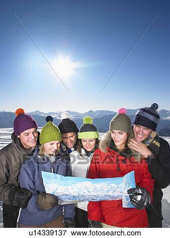 Stock Photo - Group looking at map. Fotosearch