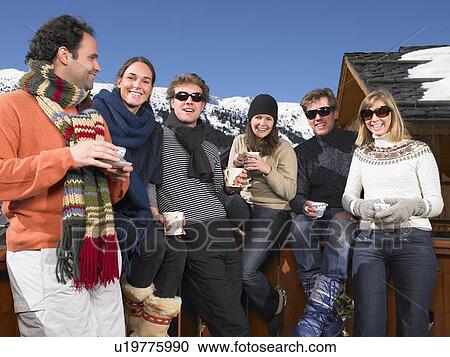Group of friends on terrace at mountains View Large Photo Image Stock Image - Group of friends on terrace at mountains. Fotosearch