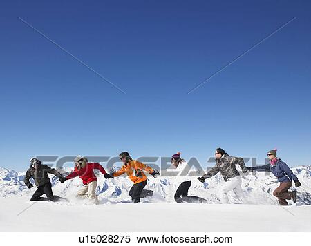 Group running in snow View Large Photo Image Stock Photography - Group running in snow. Fotosearch