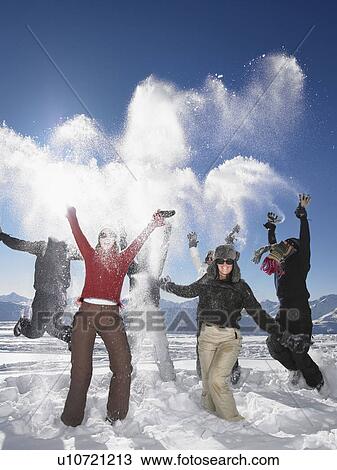 Group throwing snowballs in air View Large Photo Image Stock Image - Group throwing snowballs in air. Fotosearch