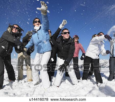 Group throwing snowballs View Large Photo Image Stock Photo - Group throwing snowballs. Fotosearch