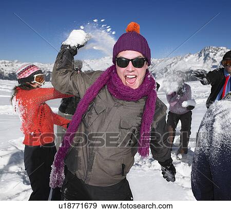 Group throwing snowballs View Large Photo Image Stock Photo - Group throwing snowballs. Fotosearch