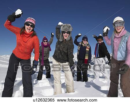 Group throwing snowballs View Large Photo Image Stock Photography - Group throwing snowballs. Fotosearch