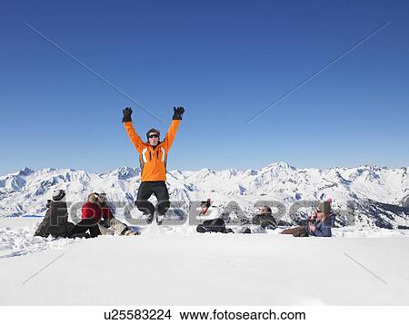 Picture - Man jumping in snow. Fotosearch
