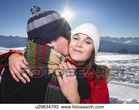 Man kissing woman on mountain top View Large Photo Image Stock Image - Man kissing woman on mountain top. Fotosearch