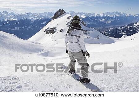Snowboarder on top of mountain View Large Photo Image Stock Image - Snowboarder on top of mountain. Fotosearch