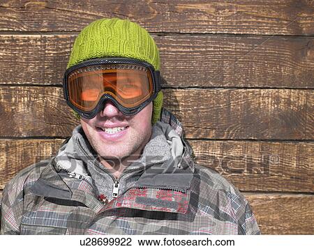 Young man in goggles and snow gear View Large Photo Image Stock Image - Young man in goggles and snow gear. Fotosearch