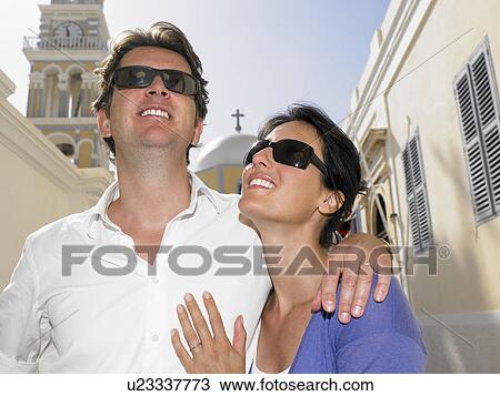 Couple with sunglasses on View Large Photo Image Stock Image - Couple with sunglasses on. Fotosearch