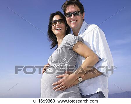 Pregnant woman and husband View Large Photo Image Stock Image - Pregnant woman and husband. Fotosearch