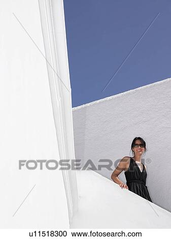 Woman climbing down the stairs View Large Photo Image Stock Image - Woman climbing down the stairs. Fotosearch