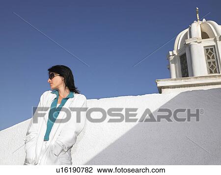 Stock Image - Woman contemplating a view. Fotosearch