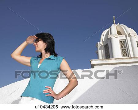 Stock Photography - Woman contemplating a view. Fotosearch
