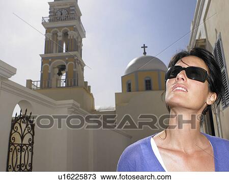 Woman with sunglasses on View Large Photo Image Stock Image - Woman with sunglasses on. Fotosearch