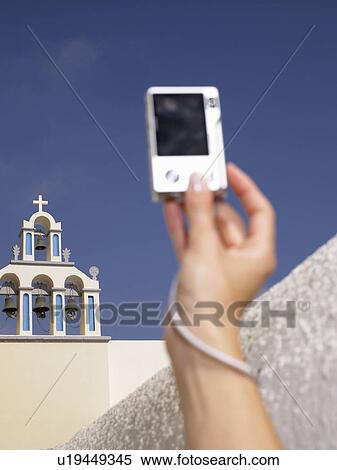 Stock Photography - Woman's hand taking a picture. Fotosearch