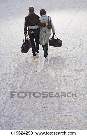 Man and woman arm in arm. View Large Photo Image Stock Image - Man and woman arm in arm.. Fotosearch