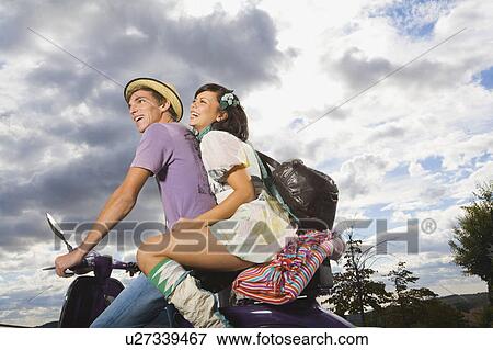 Man and woman on scooter. View Large Photo Image Stock Photo - Man and woman on scooter.. Fotosearch