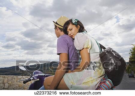 Man and woman on scooter. View Large Photo Image Stock Photograph - Man and woman on scooter.. Fotosearch