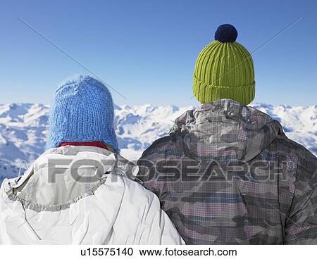 Stock Image - Couple admiring mountain view. Fotosearch