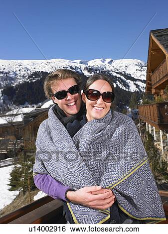 Couple in blanket at mountains View Large Photo Image Stock Photograph - Couple in blanket at mountains. Fotosearch