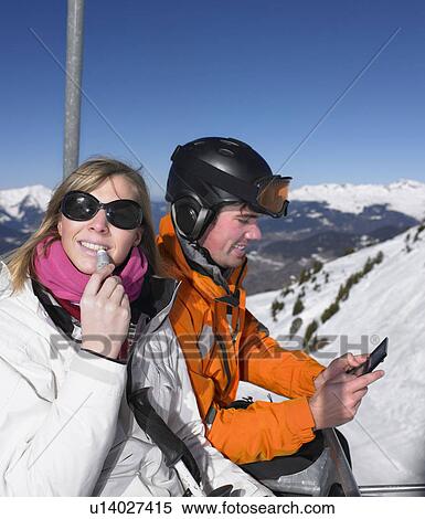 Couple on ski lift View Large Photo Image Stock Photography - Couple on ski lift. Fotosearch