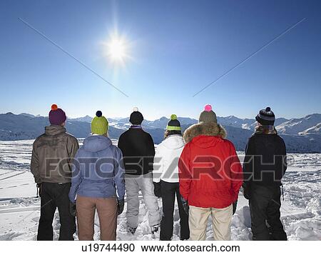 Stock Image - Group admiring mountain view. Fotosearch