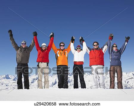 Stock Photo - Group holding hands in air. Fotosearch