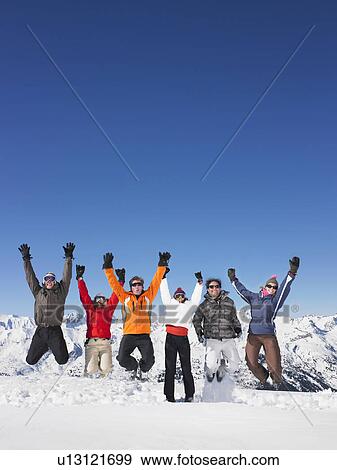 Group jumping in snow View Large Photo Image Stock Photo - Group jumping in snow. Fotosearch
