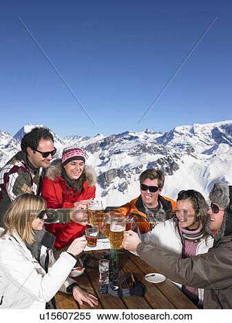 Group of friends having drink on terrace View Large Photo Image Stock Photography - Group of friends having drink on terrace. Fotosearch