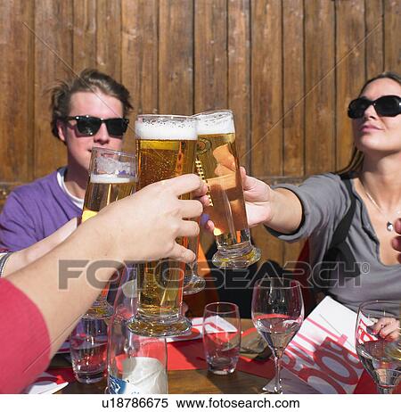 Group of friends having drink on terrace View Large Photo Image Stock Photography - Group of friends having drink on terrace. Fotosearch