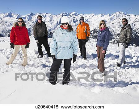 Group standing in snow View Large Photo Image Stock Photography - Group standing in snow. Fotosearch