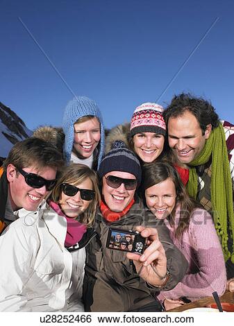 Group taking picture of themselves View Large Photo Image Stock Photograph - Group taking picture of themselves. Fotosearch