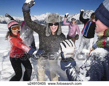 Group throwing snowballs View Large Photo Image Stock Photography - Group throwing snowballs. Fotosearch