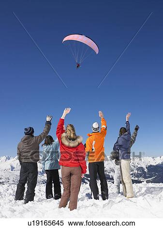 Group waving at parachutist View Large Photo Image Stock Photography - Group waving at parachutist. Fotosearch