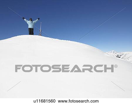 Skier admiring mountain view View Large Photo Image Stock Image - Skier admiring mountain view. Fotosearch