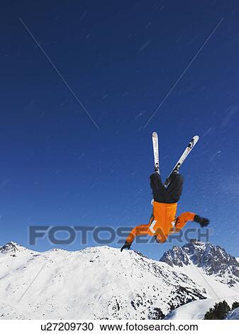 Stock Image - Skier jumping upside down. Fotosearch