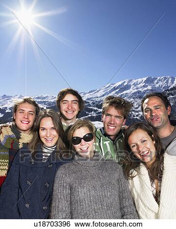 Stock Photograph - Smiling group at mountains. Fotosearch