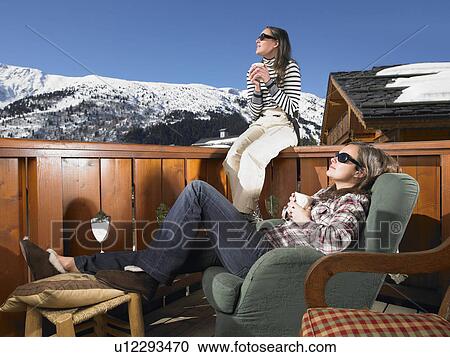 Young women enjoying sun at mountains View Large Photo Image Stock Image - Young women enjoying sun at mountains. Fotosearch