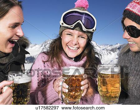 Young women having drink at mountains View Large Photo Image Stock Photo - Young women having drink at mountains. Fotosearch