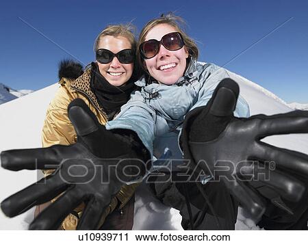 Young women with outstretched arms View Large Photo Image Stock Image - Young women with outstretched arms. Fotosearch