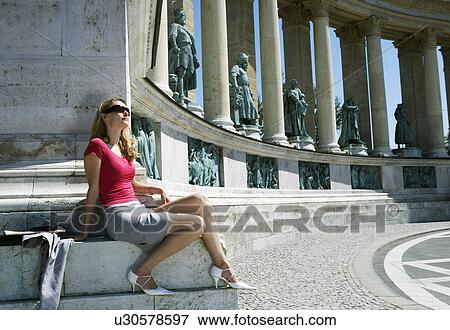 Stock Photo - Businesswoman in Hero Square.. Fotosearch