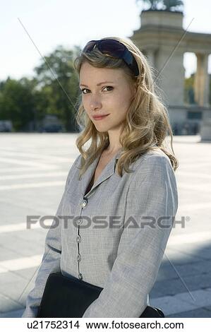 Picture - Businesswoman standing outdoors.. Fotosearch