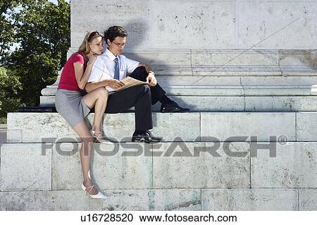 Couple relaxing in Hero Square. View Large Photo Image Stock Image - Couple relaxing in Hero Square.. Fotosearch
