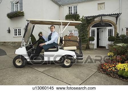 Man driving golf cart with luggage. View Large Photo Image Stock Photography - Man driving golf cart with luggage.. Fotosearch