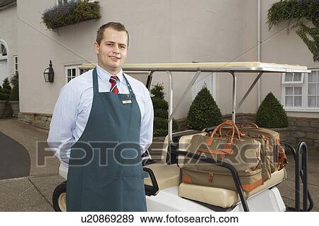 Stock Photo - Portrait of man with luggage.. Fotosearch