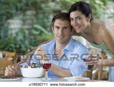 A couple eating a meal View Large Photo Image Stock Image - A couple eating a meal. Fotosearch