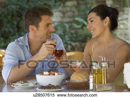 Stock Photography - A couple eating at a restaurant. Fotosearch