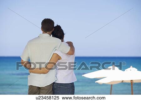 A couple relaxing on holiday View Large Photo Image Stock Photography - A couple relaxing on holiday. Fotosearch